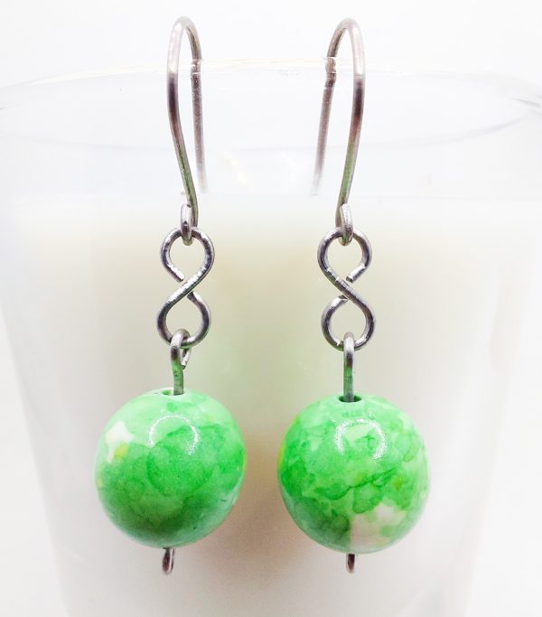 Titanium earrings with green flower jade